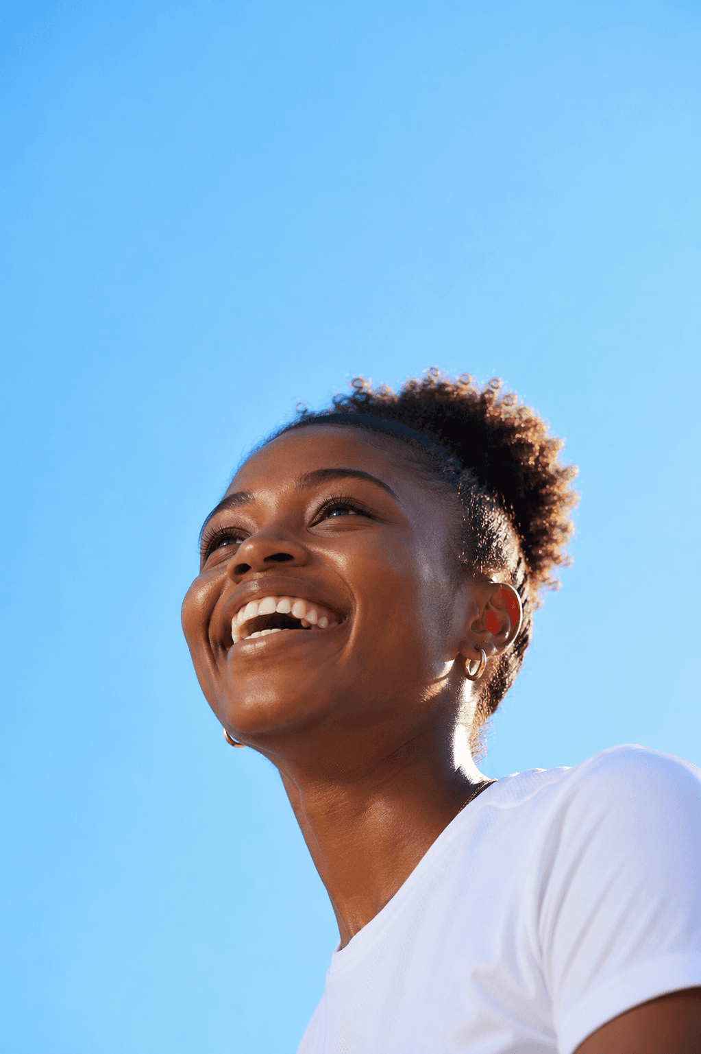 Woman looking up smiling