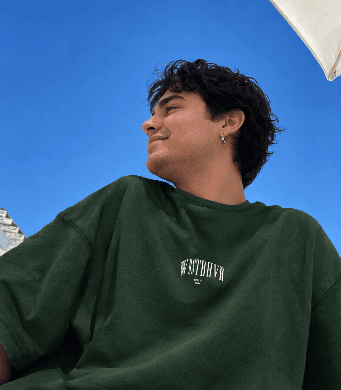 Man outdoors wearing a dark green shirt